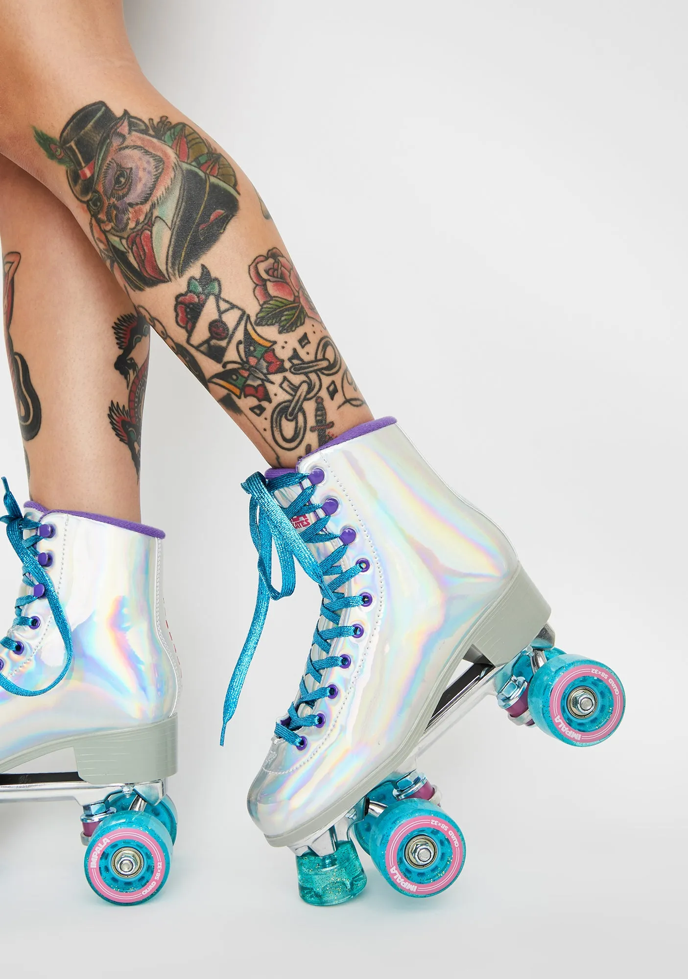 Holographic Impala Quad Skates